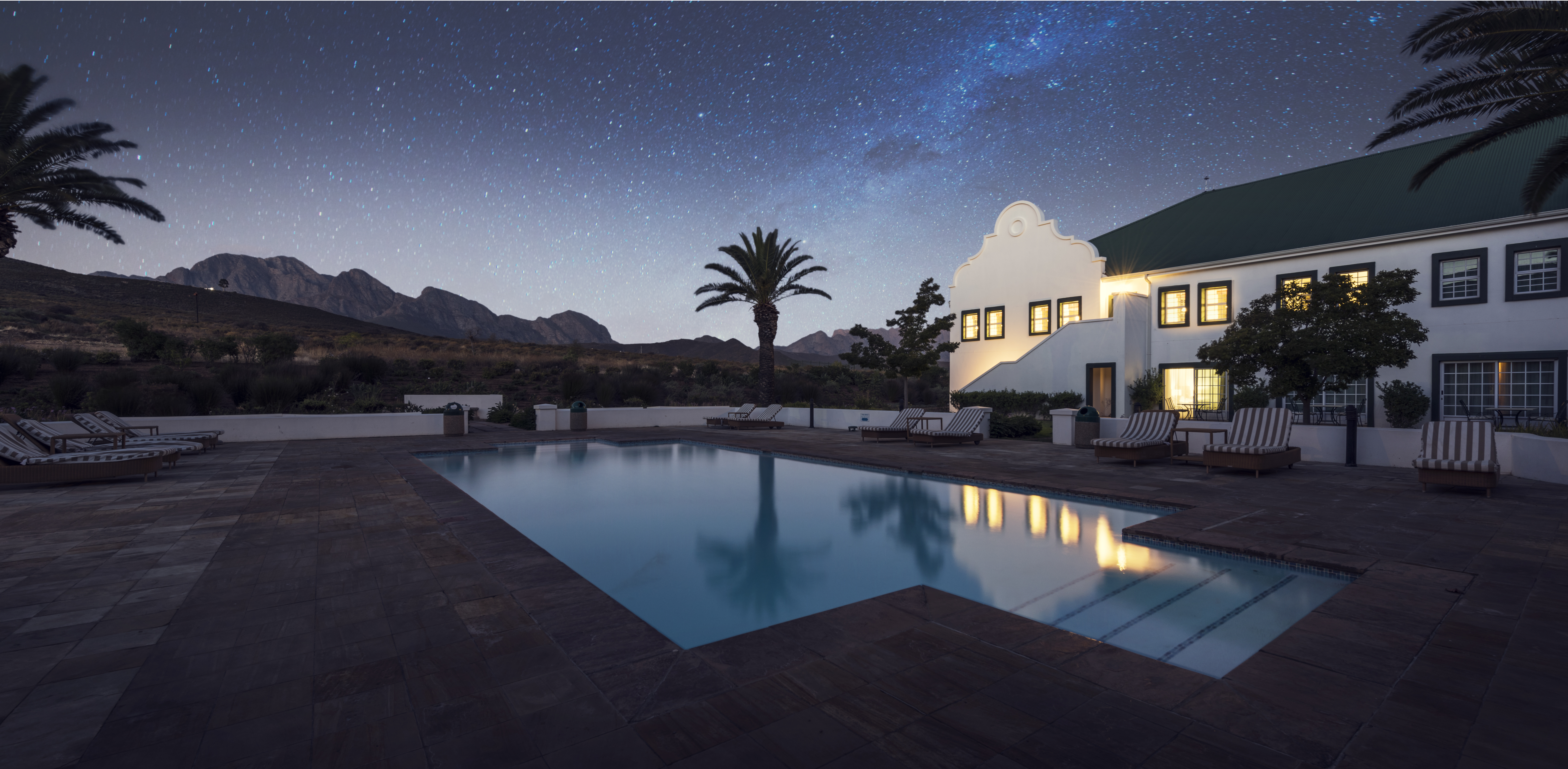 Gold Pool Night Hotel Mountain Sky View 1