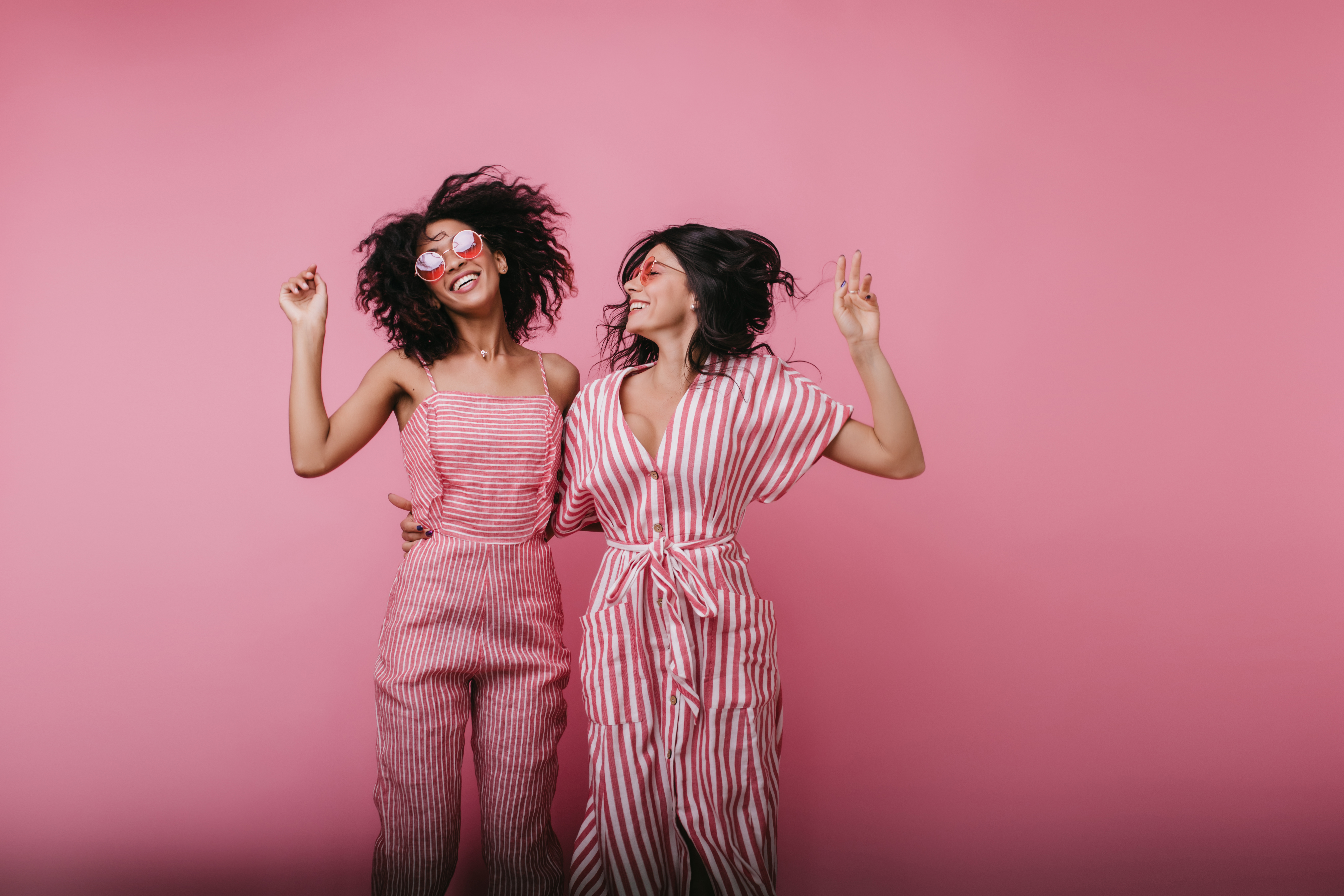 Excited Young Ladies Jumping Laughing Portrait African Girl With Short Hairstyle Dancing With Her Best Friend